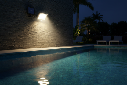 Solar Wall Light illuminating pool area at night